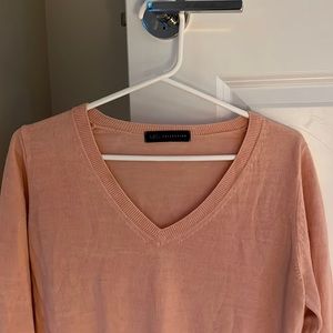 A baby pink M&S sweater